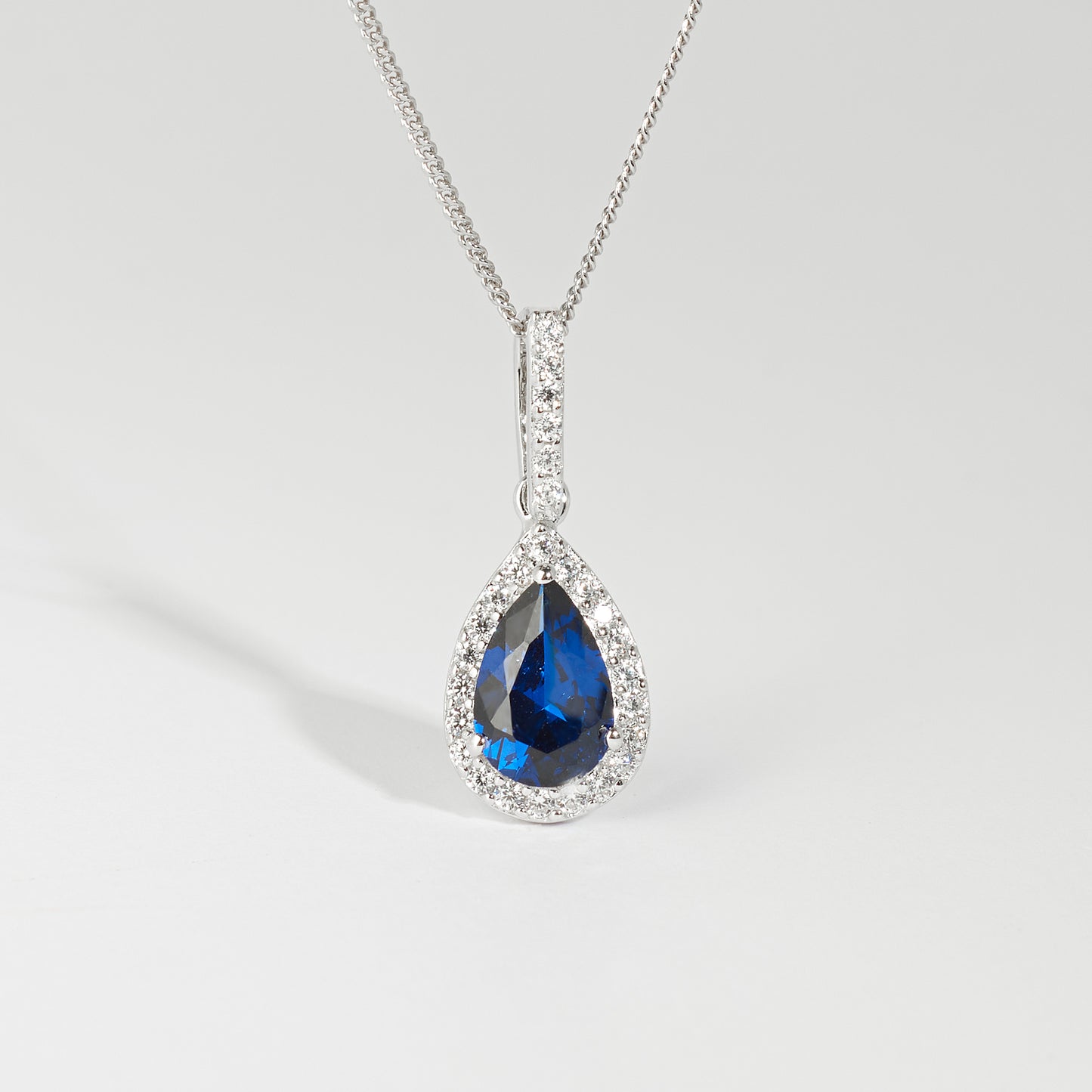 Sterling Silver Blue Pear Zirconia Halo Pendant