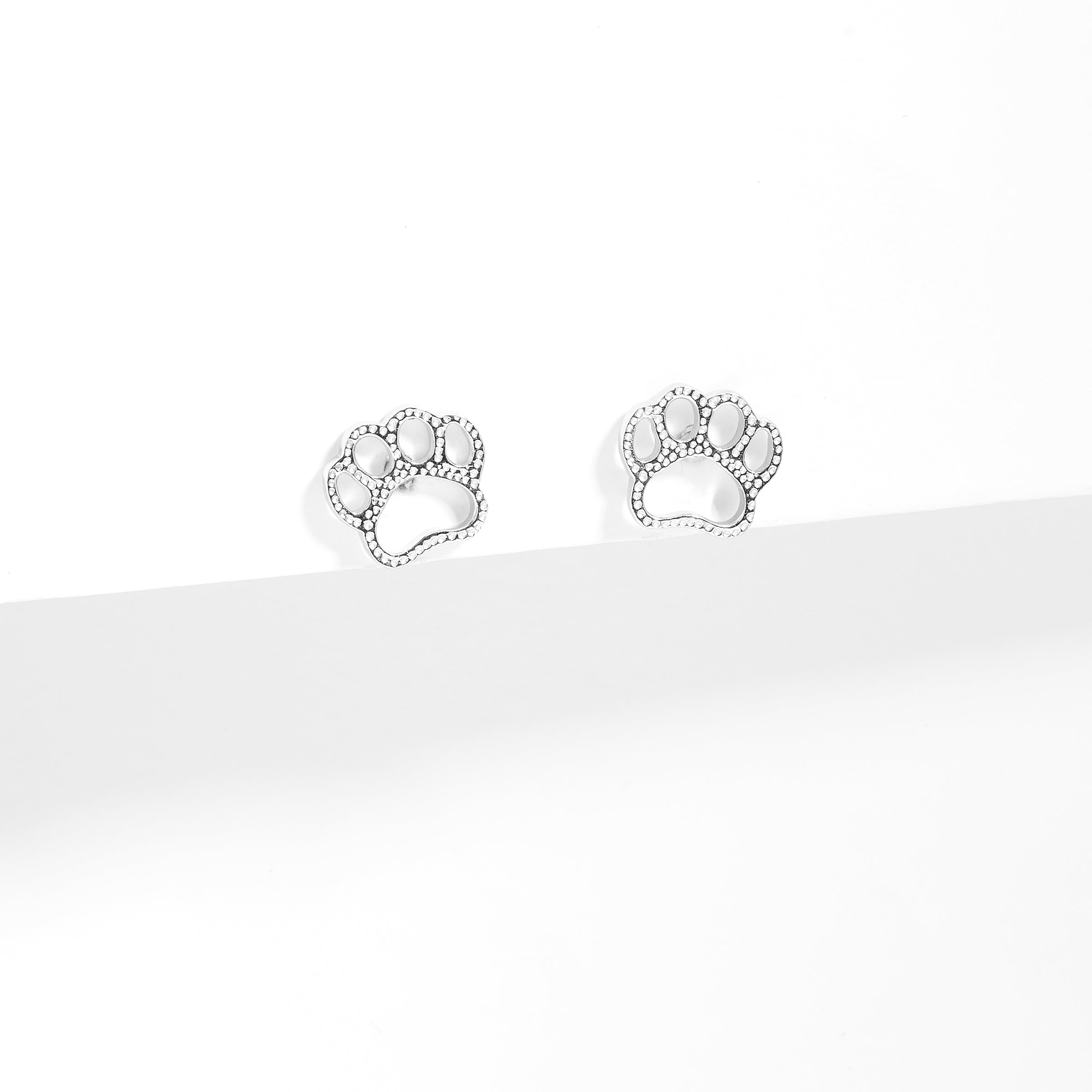 Paw print earrings white on sale gold