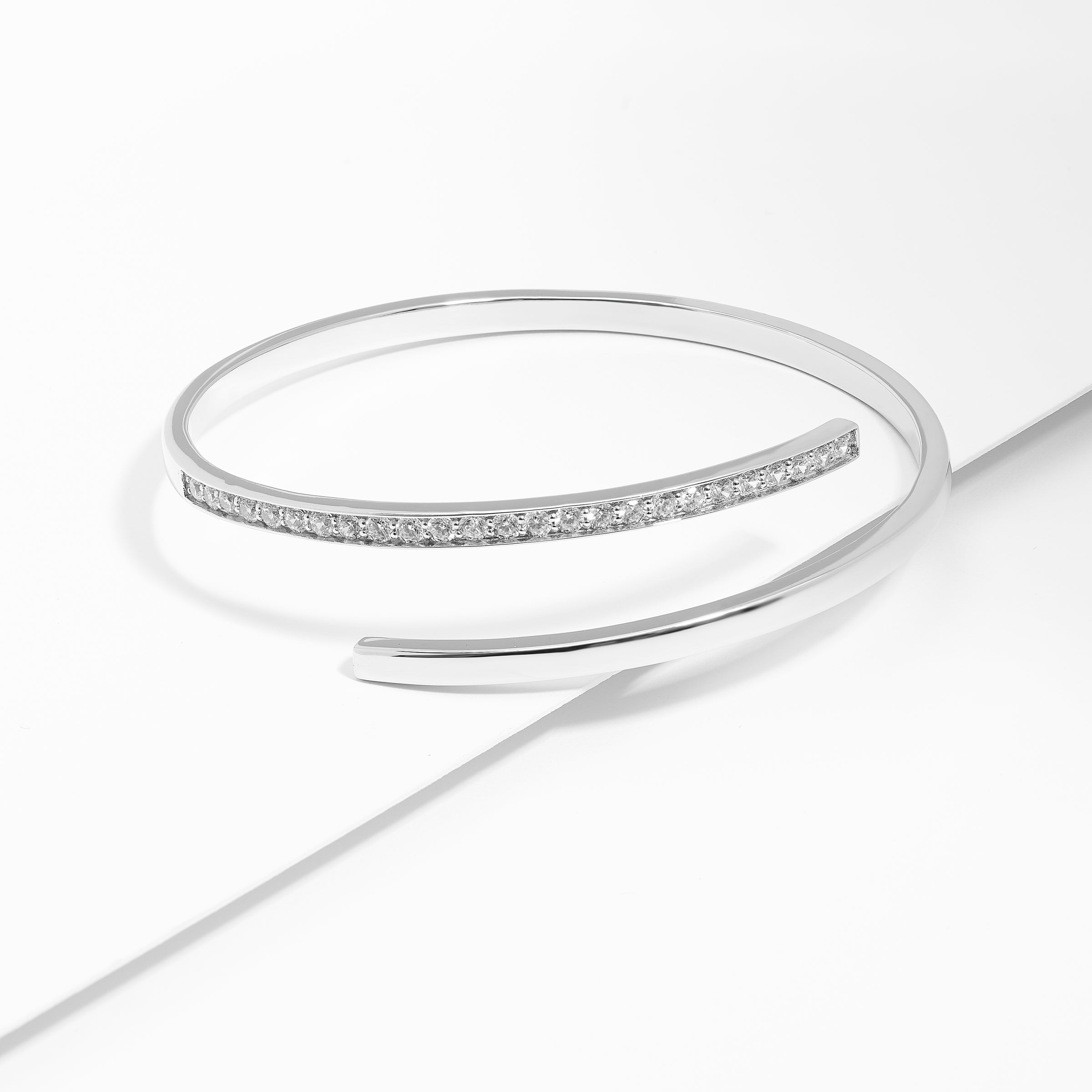 Sterling Silver Zirconia Oval Bypass Bangle 65mm – Simon Curwood Jewellers